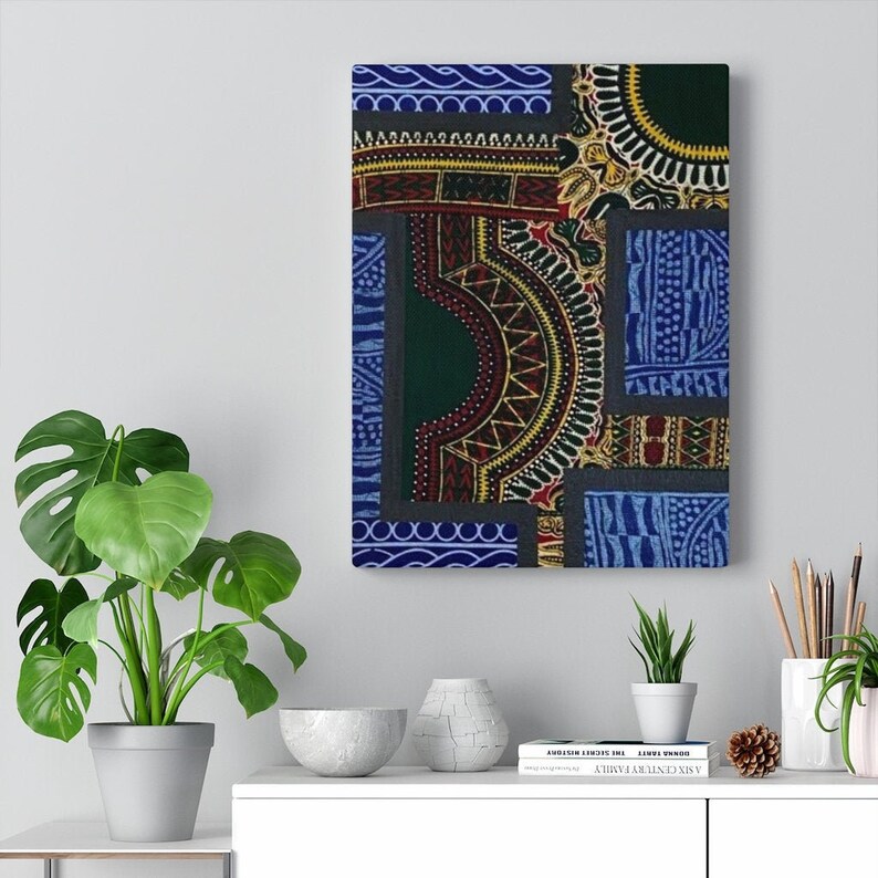 May include: A colorful abstract wall art print featuring a patchwork of geometric patterns in shades of blue, green, red, yellow, and black. The print is framed and ready to hang.
