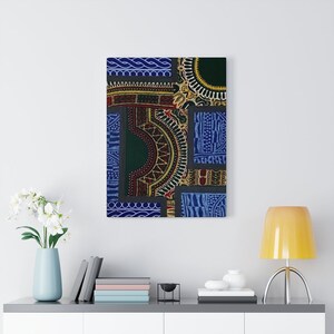 May include: Abstract art print featuring a patchwork of colorful geometric patterns in shades of blue, green, red, and yellow. The print is framed and hanging on a white wall.