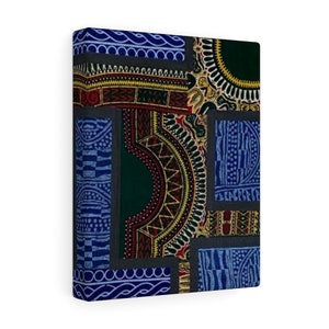 May include: A square canvas print featuring a patchwork design of colorful geometric patterns in shades of blue, green, red, yellow, and black. The patterns are arranged in a grid-like formation, creating a visually interesting and abstract design.