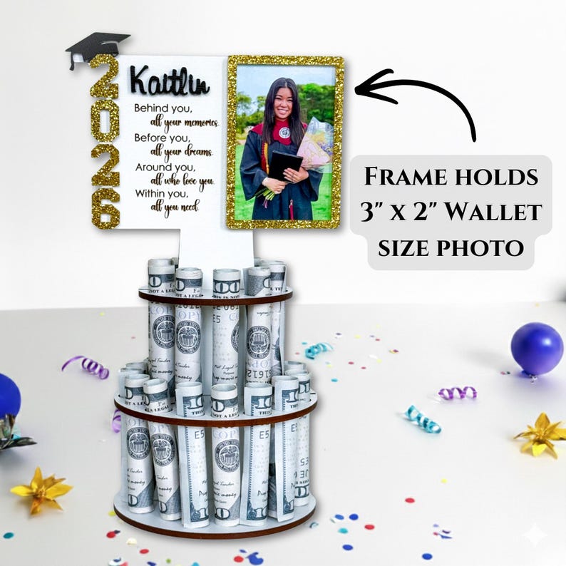 Graduation money holder 2026 photo frame option shown holding a 3x2 wallet-size photo. Personalized graduation money tree gift with rolled US dollar bill slots and Class of 2026 design. Graduation decorations Class of 2026 cash gift display.