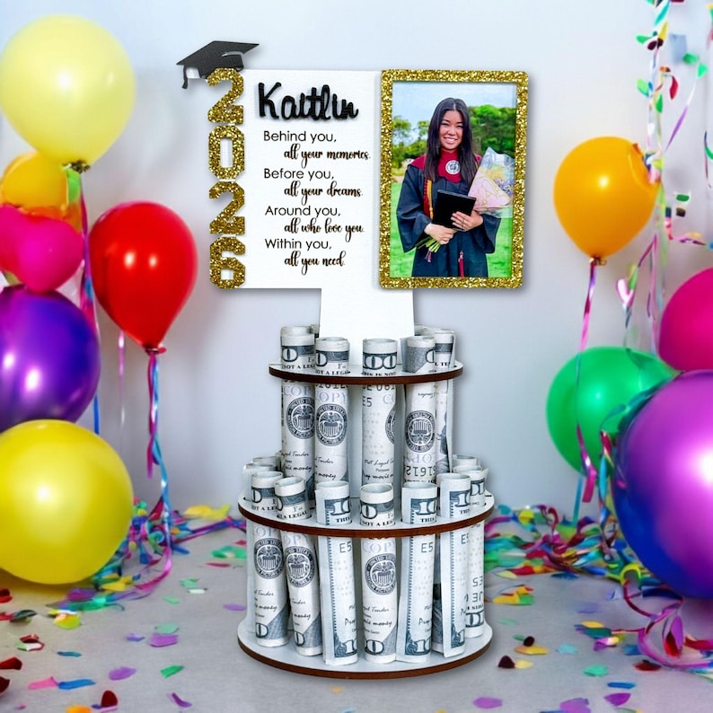 Personalized graduation money holder 2026 with photo frame option holding a wallet-size photo. Wooden graduation money tree gift with rolled cash slots, custom name, and Class of 2026 design. Graduation decorations Class of 2026 and unique graduation cash gift.