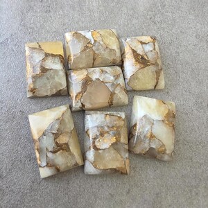 May include: Six rectangular cabochons featuring a polished surface with a mosaic-like pattern of cream, beige, and translucent white stone segments separated by thin, metallic copper-colored veins throughout each individual piece.