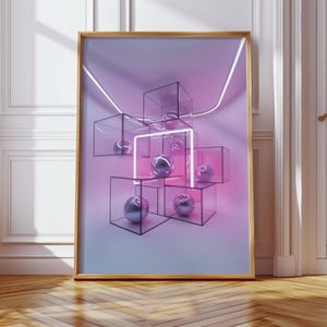 May include: A framed art print featuring a modern abstract design. The artwork showcases transparent cubes with metallic spheres, illuminated by neon pink and white lines against a gradient purple and blue background. The frame is gold, and the print is displayed on a wooden floor.
