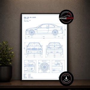 May include: Framed blueprint of a BMW E46 M3 Coupe, featuring side, front, and rear elevations, along with wheel details. The print includes dimensions in inches and is displayed on a dark shelf with a plant and storage boxes.