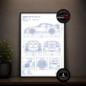 May include: Framed blueprint-style print of a Porsche 997 GT3 RS 4.0, featuring side, front, and rear elevations, plus wheel details. The print includes dimensions in millimeters and the text "ACCELERPRINTS" and "DIGITAL DOWNLOAD".