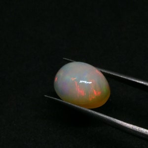 14.40 Carats Ethiopian White OPAL Lots of Play of Color. 22 x 13 mm Size