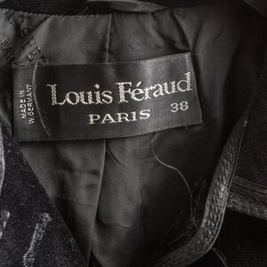 May include: Black velvet jacket with a black label that reads "Louis F&eacute;raud PARIS 38" and "MADE IN GERMANY".