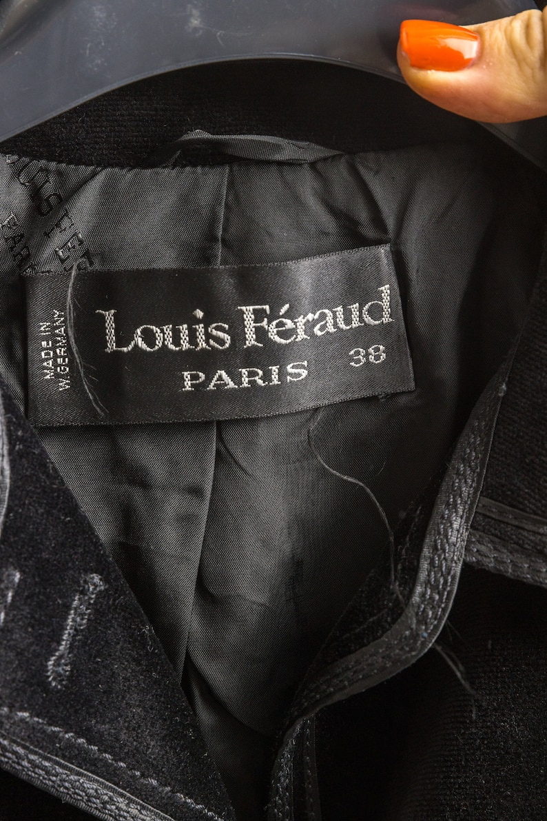 May include: Black velvet jacket with a black label that reads "Louis F&eacute;raud PARIS 38" and "MADE IN GERMANY".