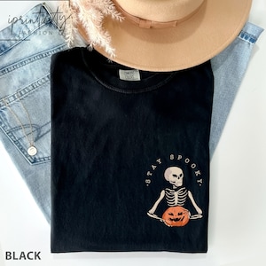 Comfort Colors® Stay Spooky t-shirt, minimal Halloween t-shirt, Skeleton pocket sweatshirt, Skeleton graphic t-shirt, Halloween 2023 t-shirt