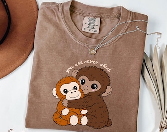 Monkey Punch Graphic Shirt, Baby Monkey Holding Plush Toy Tee, Animal Lover Gift, Cute Trendy Shirt, Unisex Casual Tee
