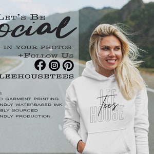 May include: White hoodie with black text that reads "Lee House" and a graphic of a line through the word "Lee". The hoodie is being worn by a woman with blonde hair. The text "Let's Be Social" is at the top of the image. The text "Tag us in your photos + Follow Us" is below the social media icons: Facebook, Instagram, and Pinterest. The text "@LeeHouseTees" is below the social media icons. The text "USA Made, Direct to Garment Printing, Eco Friendly Waterbased Ink, Sustainably Sourced, Eco Friendly Production" is at the bottom of the image.