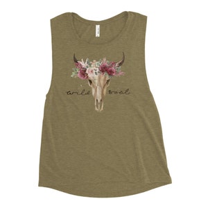 May include: A green tank top with a floral skull design and the text "wild soul".