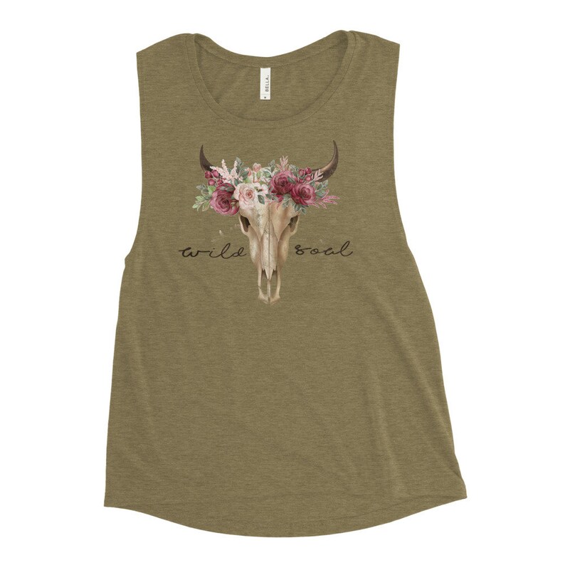 May include: A green tank top with a floral skull design and the text "wild soul".
