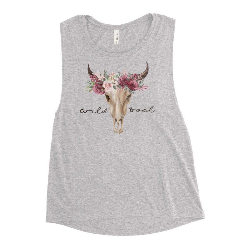 May include: A gray muscle tank top with a floral skull design and the text "wild soul".