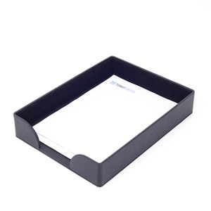 May include: A black leather desk organizer with a white sheet of paper inside. The paper has the text "Target Office" printed on it.
