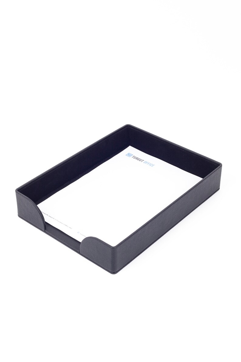May include: A black leather desk organizer with a white sheet of paper inside. The paper has the text "Target Office" printed on it.