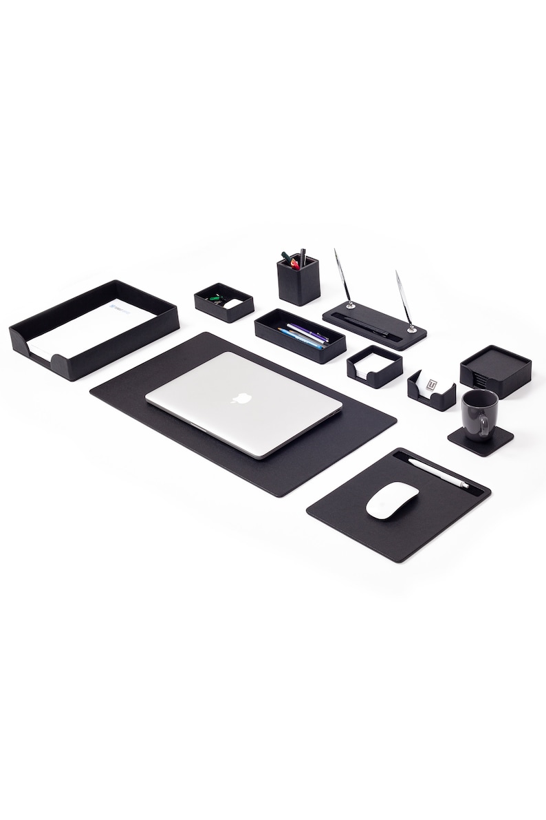 May include: Black desk organizer set with a laptop, mouse pad, pen holder, and other office supplies.