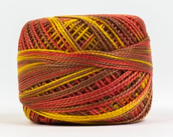 May include: A tightly wound ball of colorful yarn. The yarn features a blend of warm colors, including shades of yellow, orange, and brown. The yarn is tightly wound, creating a compact, textured appearance. Ideal for various crafting projects.