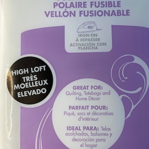 May include: Purple packaging for fusible fleece fabric. The packaging features an iron-on label with the text "Iron-on à repasser Activación con plancha". The text "High Loft Très Moelleux Elevado" is also visible. The packaging lists uses for the fabric, including quilting, tote bags, home décor, piqué, bags, interior decoration, and acolchadas, bolsones y decoración para el hogar.