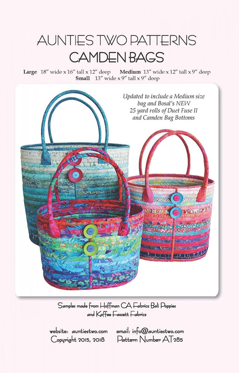 May include: Aunties Two Patterns Camden Bags. Three fabric tote bags in large, medium, and small sizes. Large: 18" wide x 16" tall x 12" deep. Medium: 13" wide x 12" tall x 9" deep. Small: 13" wide x 9" tall x 9" deep. Bags feature colorful fabric strips and buttons.
