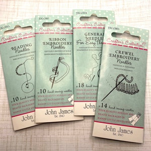 May include: Four packages of John James Crafter's Collection needles for various embroidery techniques. The packages are light blue with illustrations of the needle types: beading, ribbon, general, and crewel. Each package includes the number of needles and the text "hand sewing needles".