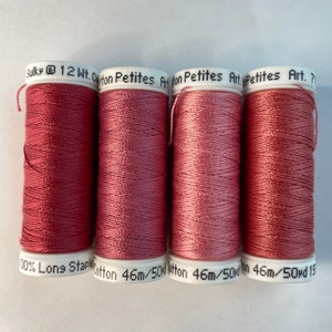 May include: Four spools of Sulky 12 Wt. Cotton Petites thread in a dusty rose color. Each spool is labeled "100% Long Staple Cotton 46m/50yd".