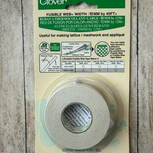 May include: A package of Clover fusible web tape, 10mm wide by 40 feet long, for fabric projects. The green and white packaging includes instructions for lattice, meshwork, and appliqu&eacute; techniques. The tape is heat-sensitive and film-like.