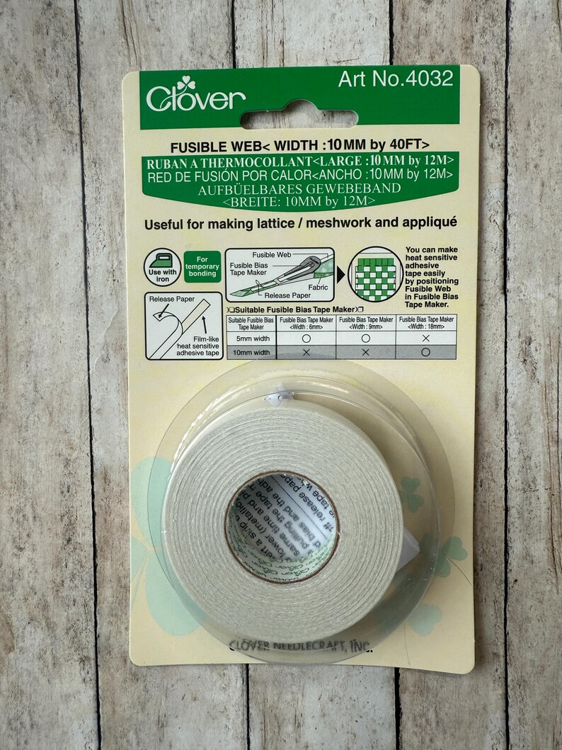 May include: A package of Clover fusible web tape, 10mm wide by 40 feet long, for fabric projects. The green and white packaging includes instructions for lattice, meshwork, and appliqu&eacute; techniques. The tape is heat-sensitive and film-like.