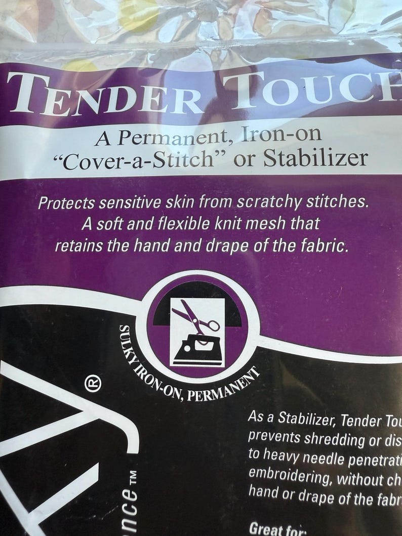May include: Tender Touch iron-on stabilizer. The package features the text "TENDER TOUCH" in white letters on a purple background. It protects sensitive skin from scratchy stitches and is a soft, flexible knit mesh.