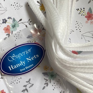 May include: A package of white netting labeled "Superior Threads Handy Nets One Dozen".