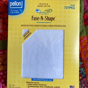 May include: A yellow package of Pellon Fuse-N-Shape fusible interfacing, a machine-safe fabric for crafts and home décor. The package shows a sample of the light blue interfacing, and lists the size as 15 inches by 36 inches (38.1 cm by 91.4 cm).