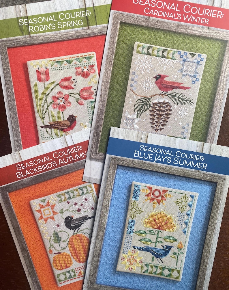 May include: Four cross-stitch patterns with seasonal themes. Each pattern is framed and features a different bird and season: Robin's Spring, Cardinal's Winter, Blackbird's Autumn, and Blue Jay's Summer. The patterns include floral and natural elements.