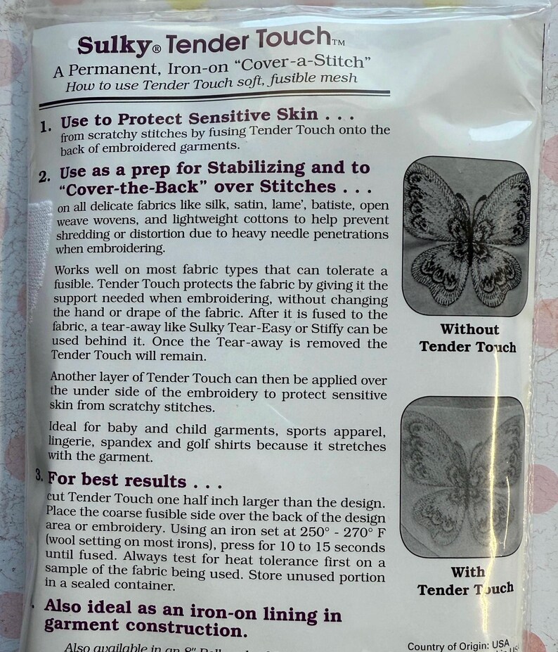 May include: A package of Sulky Tender Touch, a permanent, iron-on "Cover-a-Stitch" fusible mesh. The packaging includes instructions for use, including protecting sensitive skin and stabilizing stitches. The package shows a butterfly design with and without the Tender Touch.