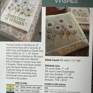 May include: A cross-stitch pattern titled "Dandelion Wishes" featuring a dandelion design. The image shows a finished pillow and a framed piece with the text "Sweetest of Wishes." The pattern includes DMC and Cosmo floss colors and stitch counts.