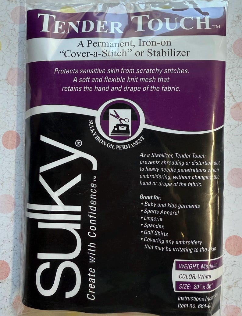 May include: A package of Sulky Tender Touch stabilizer. The package is white and purple with the Sulky logo and product information. The stabilizer is iron-on and measures 20" x 36". It is designed to protect sensitive skin and prevent distortion during embroidery.