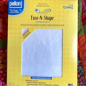 May include: A yellow and white package of Pellon Fuse-N-Shape medium two-sided fusible firm interfacing. The packaging features the text Pellon, The Magic in the Middle, Crafts & Home Décor, Style# 721PKG, and dimensions of 15 inches by 36 inches.