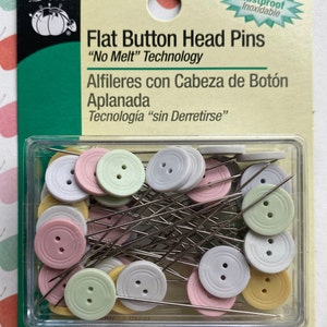 May include: A package of 30 flat button head pins with a "No Melt" technology. The pins are made of stainless steel and have a variety of colors, including green, pink, and white.