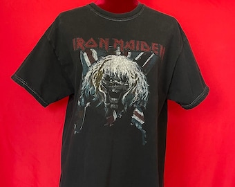 May include: Black t-shirt with a graphic of a skull with the text "Iron Maiden" above it.