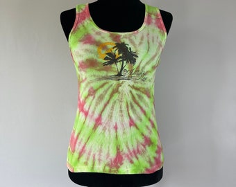 May include: A green and pink tie-dye tank top with a palm tree graphic and the text "Sunsets & Salty Air".