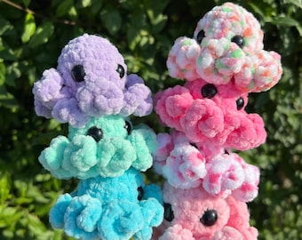 Crocheted baby octopus made of chenille yarn with safety eyes; available in a variety of colors; perfect gift for children as a lucky charm.