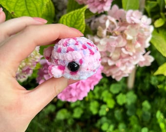 Crocheted baby whale made of chenille yarn with safety eyes; available in a variety of colors; perfect gift for children as a lucky charm