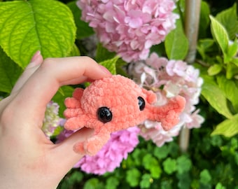 Crocheted baby crab made of chenille yarn with safety eyes; available in a variety of colors; perfect gift for children as a lucky charm.