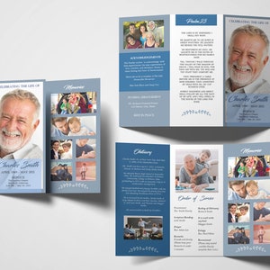 May include: A blue and white tri-fold funeral program with a photo of a man on the front cover. The program includes an obituary, order of service, and memories. The text on the front cover reads "Celebrating the Life of Charles Smith, April 1969 - May 2021".