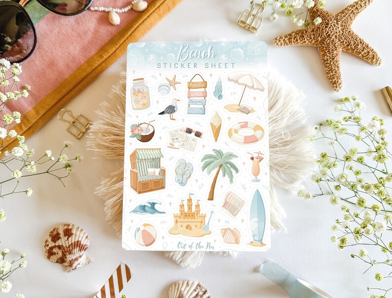 May include: A sticker sheet with a beach theme. The sheet includes stickers of a beach umbrella, a beach chair, a sandcastle, a surfboard, a coconut, a seagull, a life preserver, a seashell, a starfish, a palm tree, and a glass jar with sand and seashells. The sheet is titled "Beach Sticker Sheet" and has the text "Out of the Sea" at the bottom.