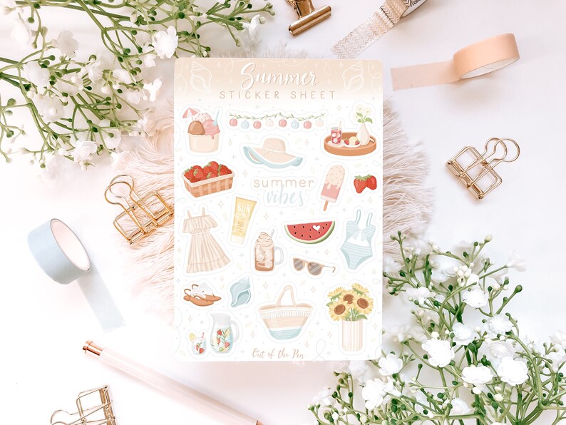 May include: A sticker sheet with a summer theme. The sheet features illustrations of a watermelon, ice cream, sunglasses, a swimsuit, a beach bag, a dress, a pitcher of lemonade, and a basket of strawberries. The text "Summer Vibes" is featured on the sheet.