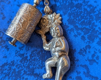 Tibetan prayer wheel and Chinese lucky figure pendant. Traditional Chinese and Tibetan pendants. silver charm necklace
