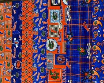 Może przedstawiać: Kolekcja skrawków tkanin z logo i maskotką Florida Gators z Uniwersytetu Florydy. Tkaniny są w różnych odcieniach niebieskiego i pomarańczowego z różnymi wzorami, w tym paisley, kratą i powtarzającym się wzorem aligatora. Tekst "Florida Gators", "The Swamp" i "Pride Gators" jest widoczny na tkaninach.