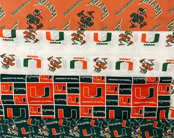 NCAA College University of Miami Hurricanes, 4 Designs, 100% Cotton Fabric.  Sold in various lengths with full widths of 43”/47”/58”, New