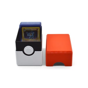 This box contains pokemon cards in a red and white Pokeball style design. This is a storage container for pokemon cards and small valuables.