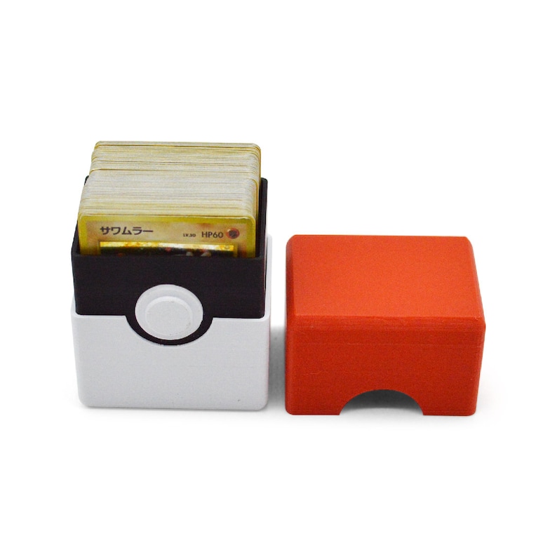 This box contains pokemon cards in a red and white Pokeball style design. This is a storage container for pokemon cards and small valuables.